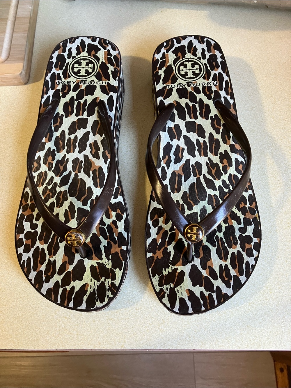 Tory Burch Leopard Print Flip Flop Sandals with Black Straps and Gold Logo